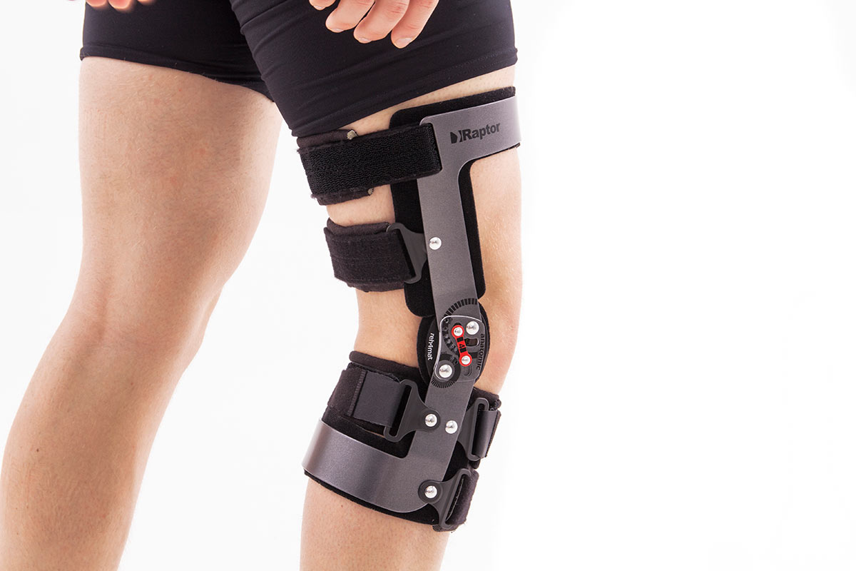 Premium Photo  Female wearing knee orthosis or knee support brace after  surgery on leg